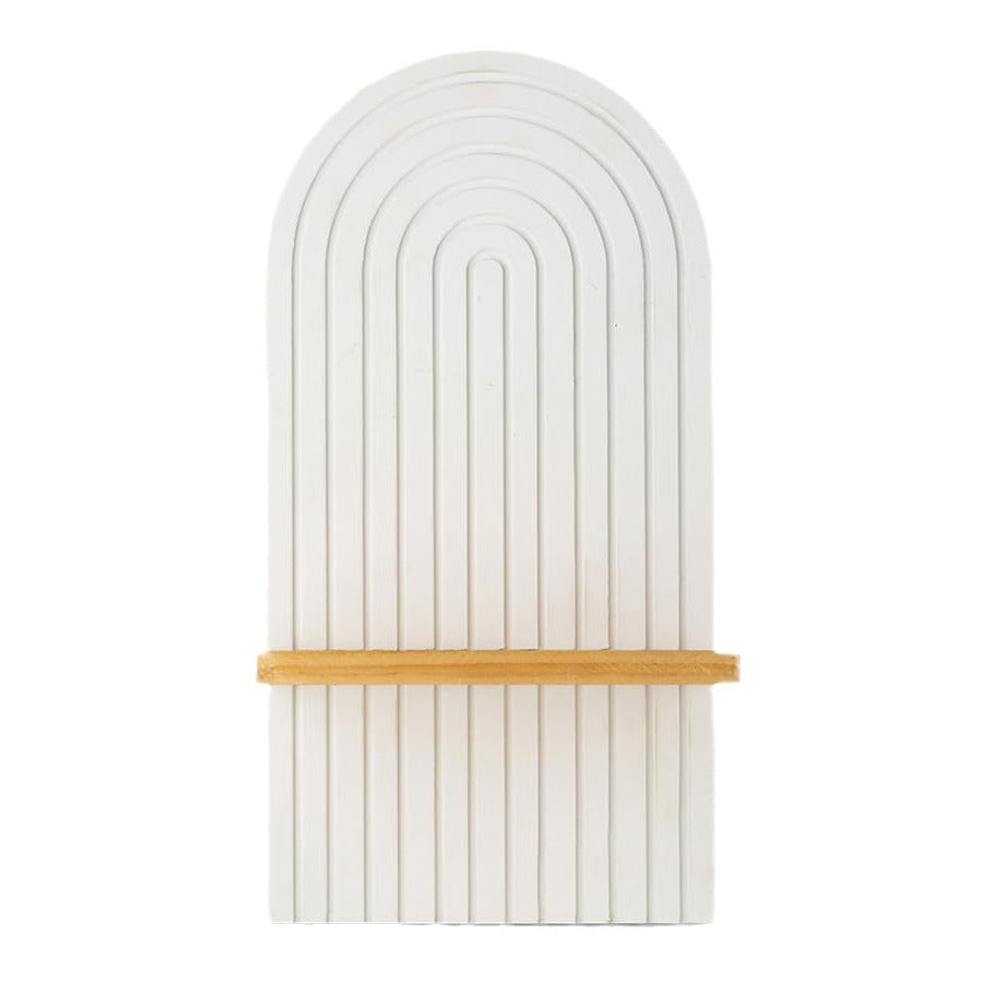 Decorative wall art with arch design and wooden strip on a white background